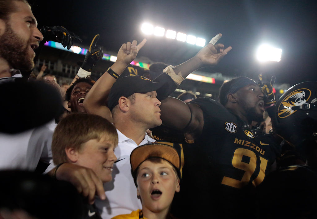 Barry Odom celebrates with fans